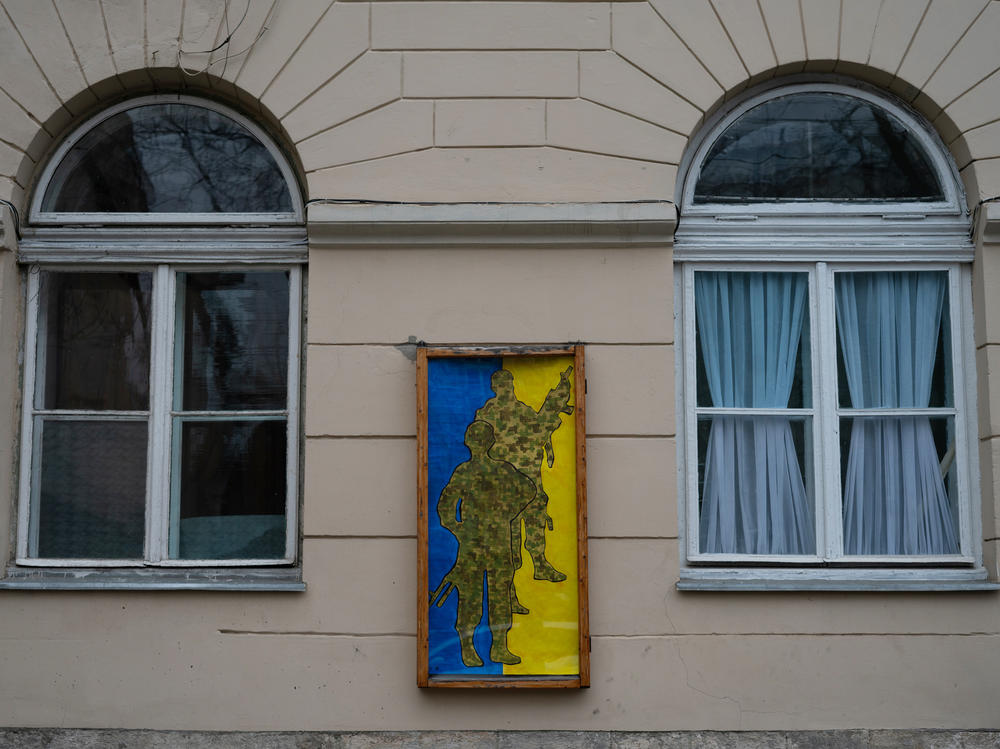 A pro-Ukrainian military poster hangs on a building in downtown Lviv, Ukraine.