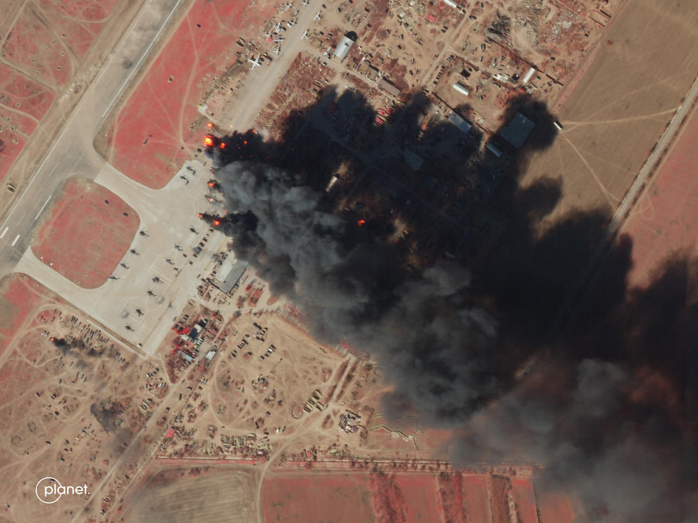 A March 15 satellite image shows fires burning at Ukraine's Kherson air base after a reported strike against Russian forces using the base. Satellites are playing a major role in documenting events in the war in Ukraine, but they have limited capabilities.