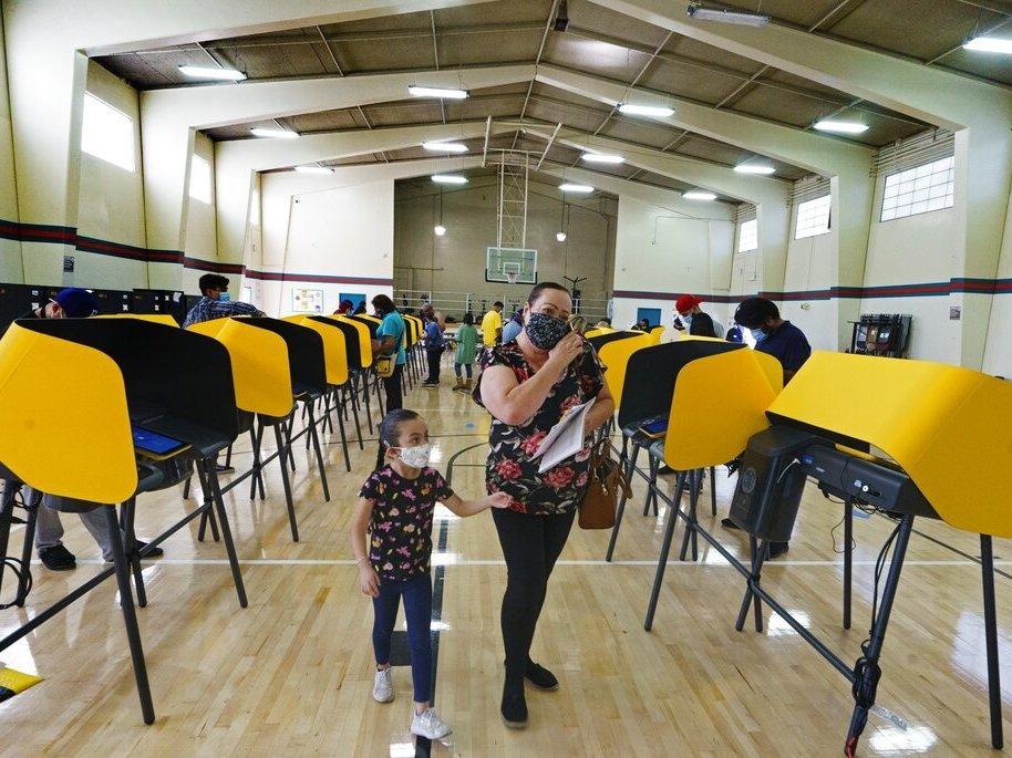 Voters cast their ballots Election Day in 2020 in East Los Angeles. Smartmatic says it's the only county they were operating in for the presidential election, but Fox News mentioned the company 137 times in a month afterward as President Trump and his allies pressed baseless claims of a rigged election.