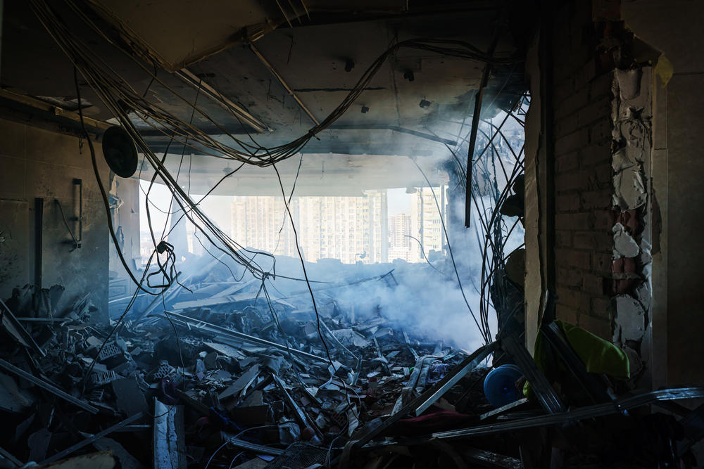 A rocket hits a residential building as seen in Kyiv, Ukraine, Saturday, Feb. 26, 2022.