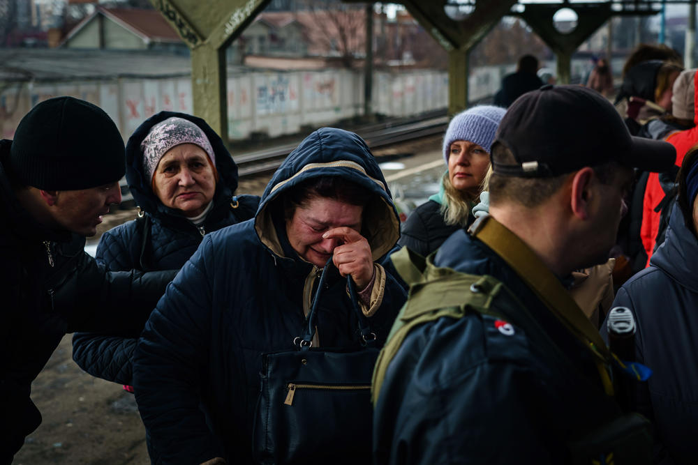 A woman breaks down in tears as she realizes she is getting to board an evacuating train. Hundreds of civilians, mostly women and children rush to evacuate on one of the last trains out of town as the sounds of battle Ð gunfire and bombing Ð fighting between Russian and Ukrainian forces draw closer to the city of Irpin, Ukraine, Friday, March 4, 2022.