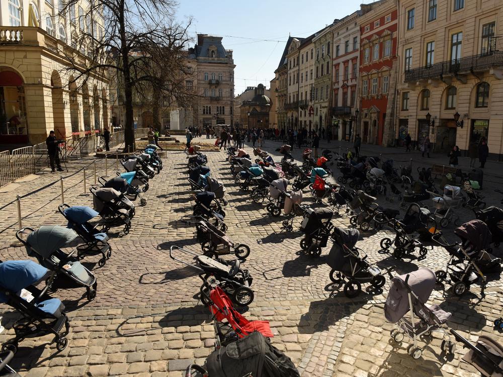 In a picture taken on Friday, 109 empty strollers are seen arrayed outside the Lviv City Council, highlighting the number of children killed in the ongoing Russian invasion of Ukraine.