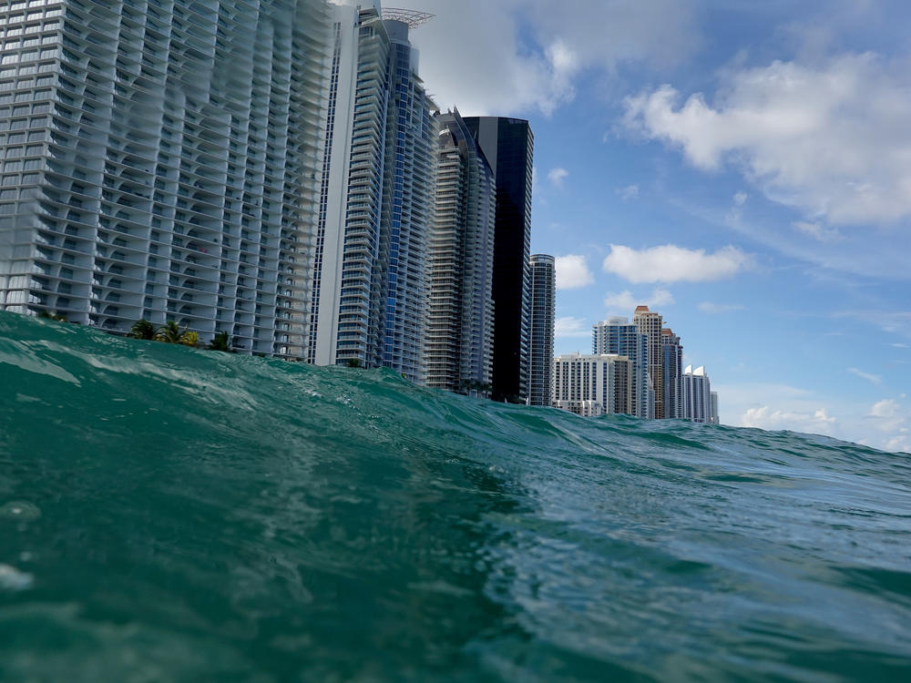Waves lap ashore near condo buildings in Sunny Isles, Fl., on Aug. 9, 2021. Rising sea levels are seen as one of the potential consequences of climate change and could impact areas such as Florida's Miami-Dade County.