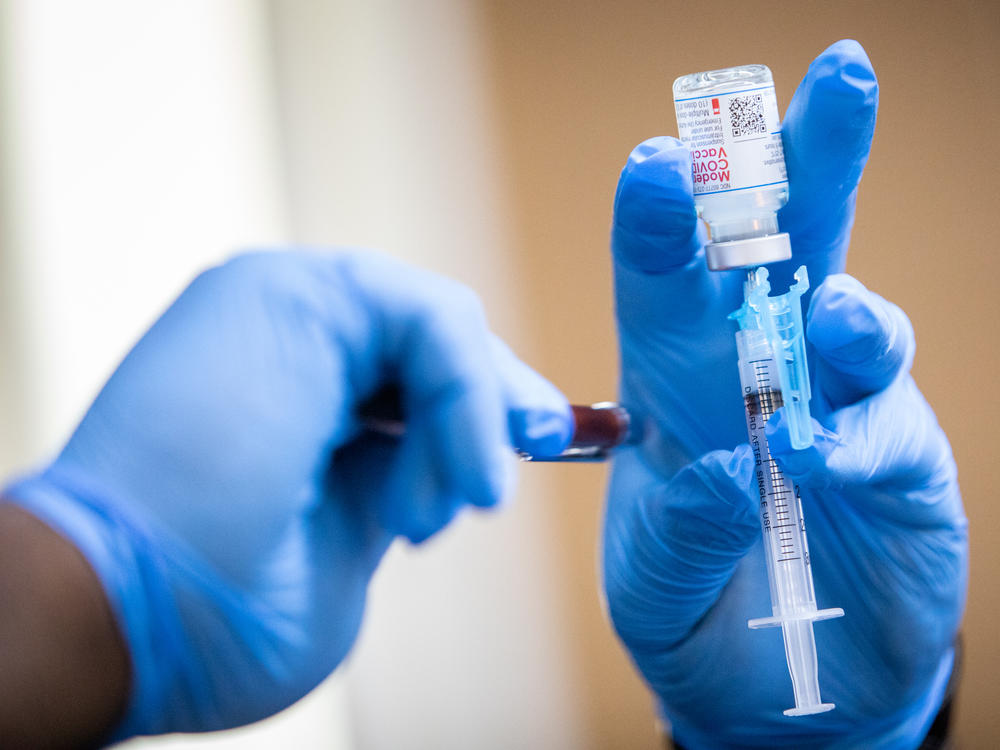 A Moderna COVID-19 vaccine is prepared during a pop-up vaccine clinic at Cristo Rey Church in East Austin last summer.