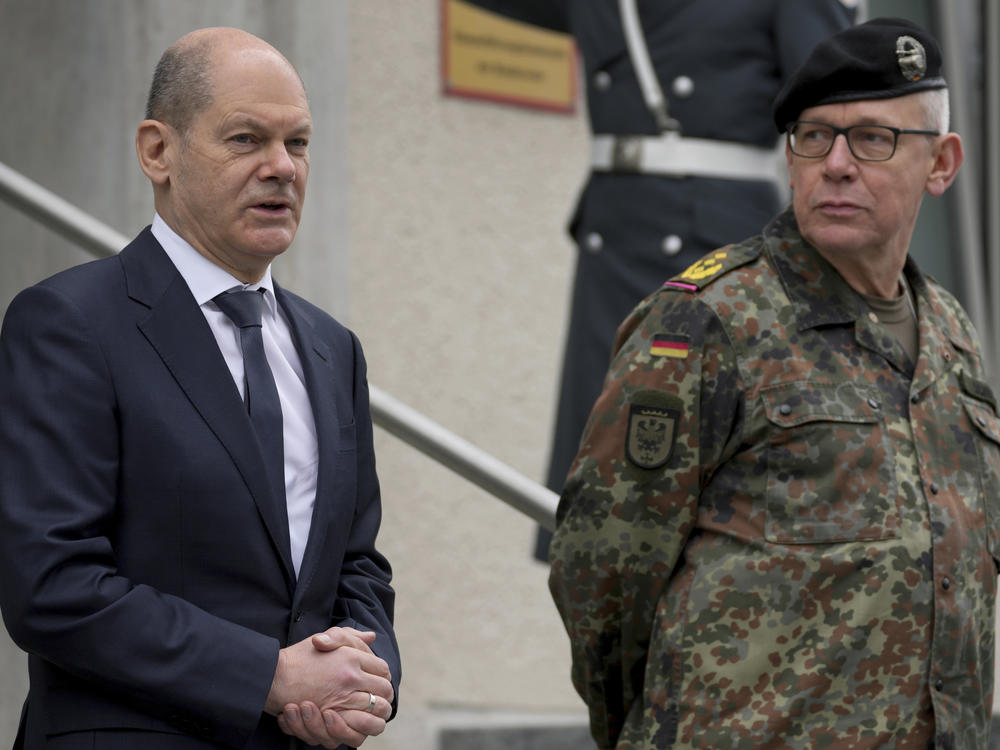 German Chancellor Olaf Scholz speaks as he arrives for a visit of the Joint Operations Command of the German armed forces in Schwielowsee near Berlin, March 4.