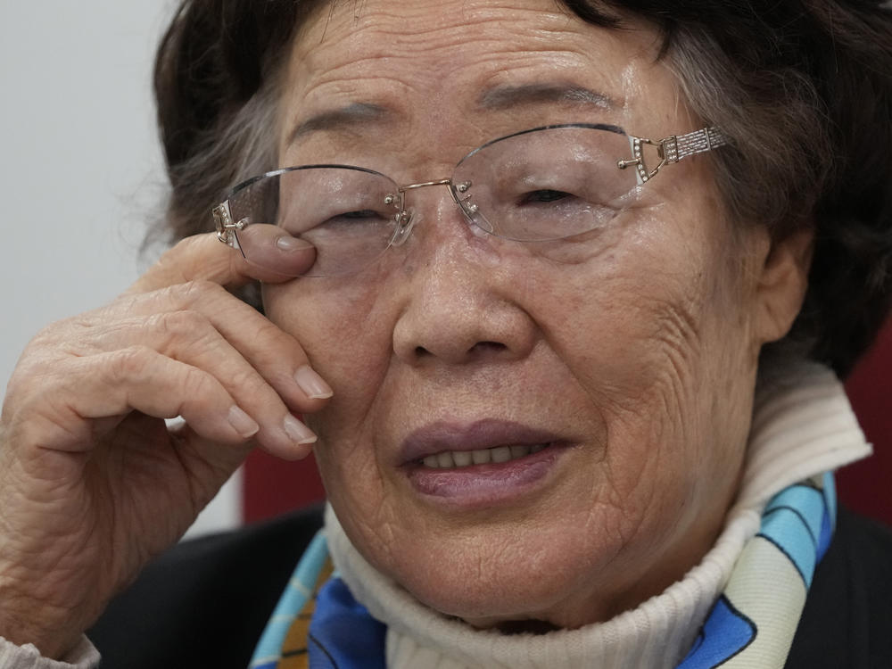 Lee Yong-soo, a South Korean sexual slavery survivor who has been demanding since the early 1990s that the Japanese government fully accept culpability and offer an unequivocal apology, wipes her tear during an interview in Seoul, South Korea, on March 16, 2022.