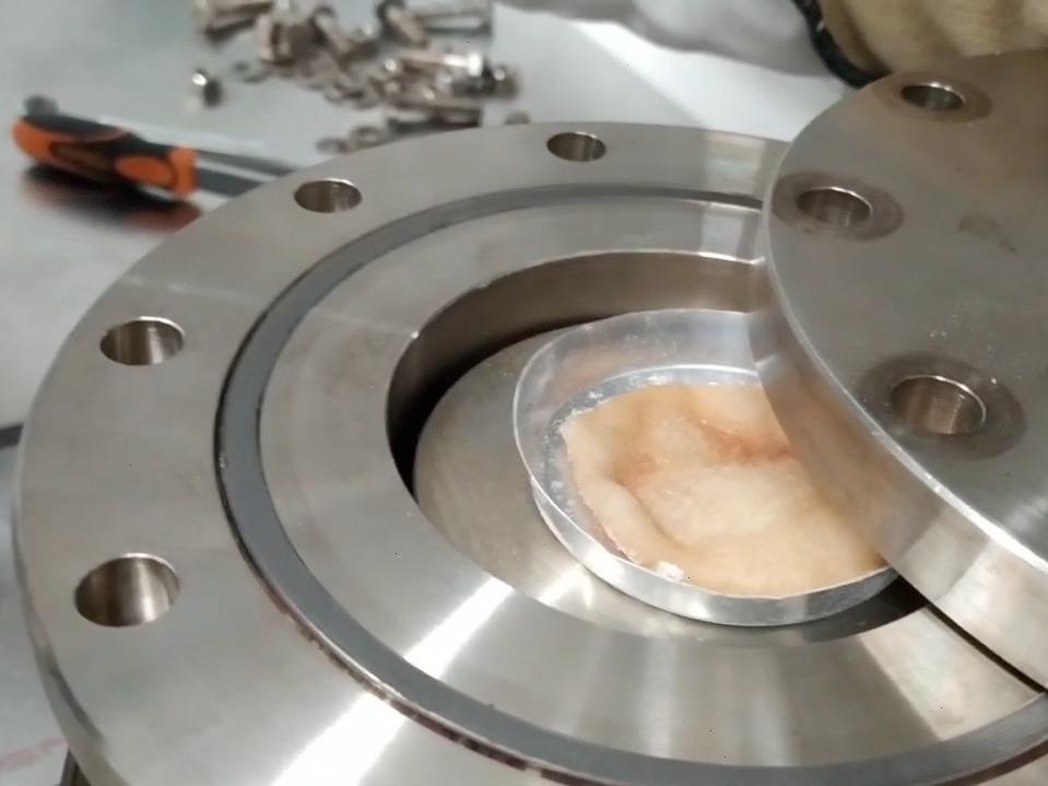 A test pizza dough is ready to be removed from the autoclave.