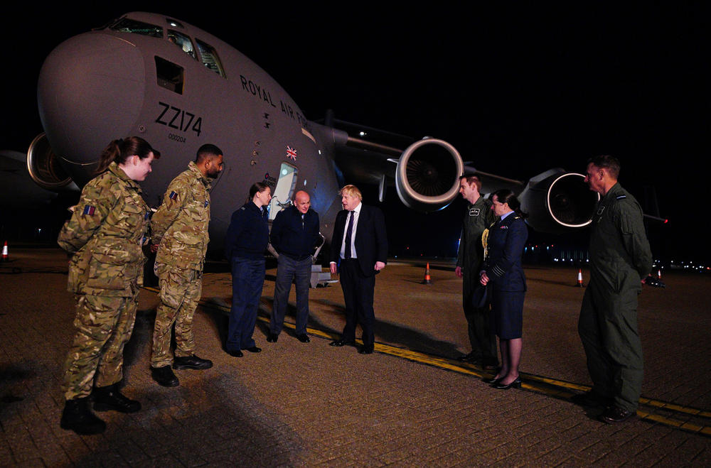 British Prime Minister Boris Johnson meets military personnel at RAF Brize Norton to thank them for their work facilitating military support to Ukraine and NATO, on Feb. 26 at Brize Norton, Oxfordshire, England.