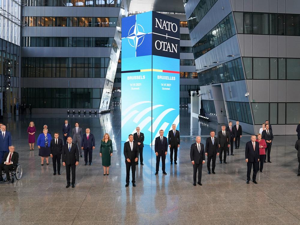 President Biden and other NATO leaders pose for the traditional family photo during a summit at the alliance's headquarters in June.