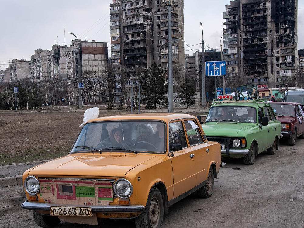 Cars wait in a long line to leave Mariupol, on March 17. The city, on Ukraine's southeastern coast, has been heavily damaged by Russian bombardment.