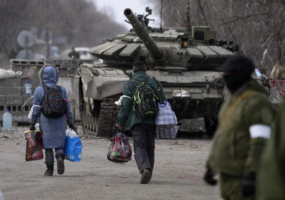 Civilians are evacuated from Mariupol on Sunday.