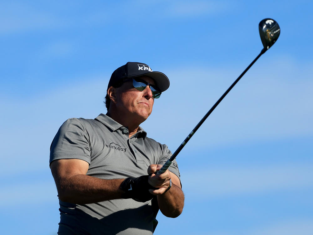 Phil Mickelson plays a shot on the fifth hole during the first round of The Farmers Insurance Open at Torrey Pines Golf Course on January 26, 2022 in La Jolla, California.