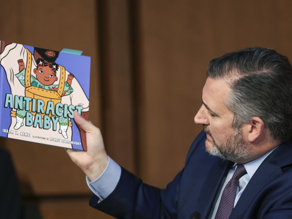 Sen. Ted Cruz holds up a book on antiracism as he questions U.S. Supreme Court nominee Judge Ketanji Brown Jackson.