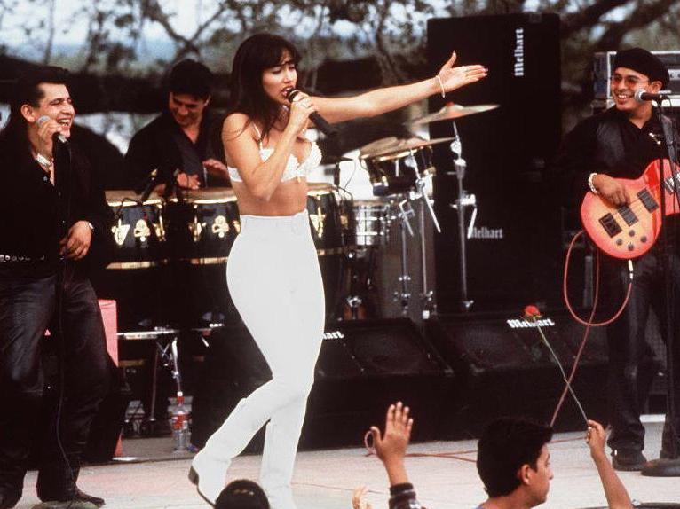 Actress Jennifer Lopez, who plays Selena Quintanilla-Perez in the movie <em>Selena</em> performs with her band in one of the scenes from the movie. The biopic will premiere in theaters next month in honors of the film's 25th anniversary.