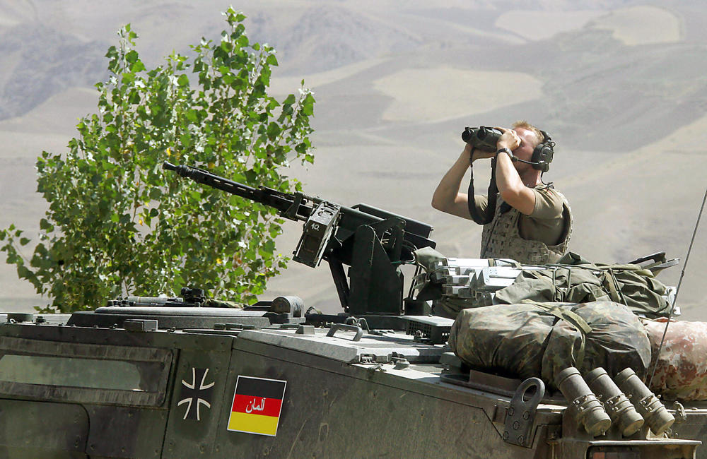 A German soldier observes the area at the airport of Faizabad, northern Afghanistan in 2006. Germany contributed thousands of troops to NATO forces in Afghanistan.