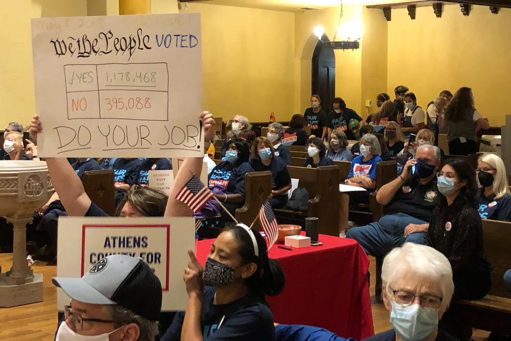 Voter rights advocates gather in a church in downtown Columbus, Ohio, for an anti-gerrymandering rally on Sept. 21, 2021.