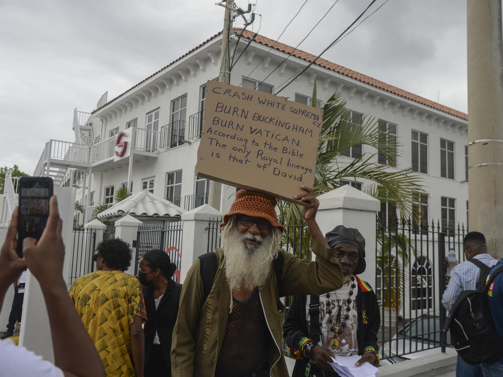 People protest to demand an apology and slavery reparations during a visit to the former British colony by the Duke and Duchess of Cambridge, Prince William and Kate, in Kingston, Jamaica, on Tuesday.