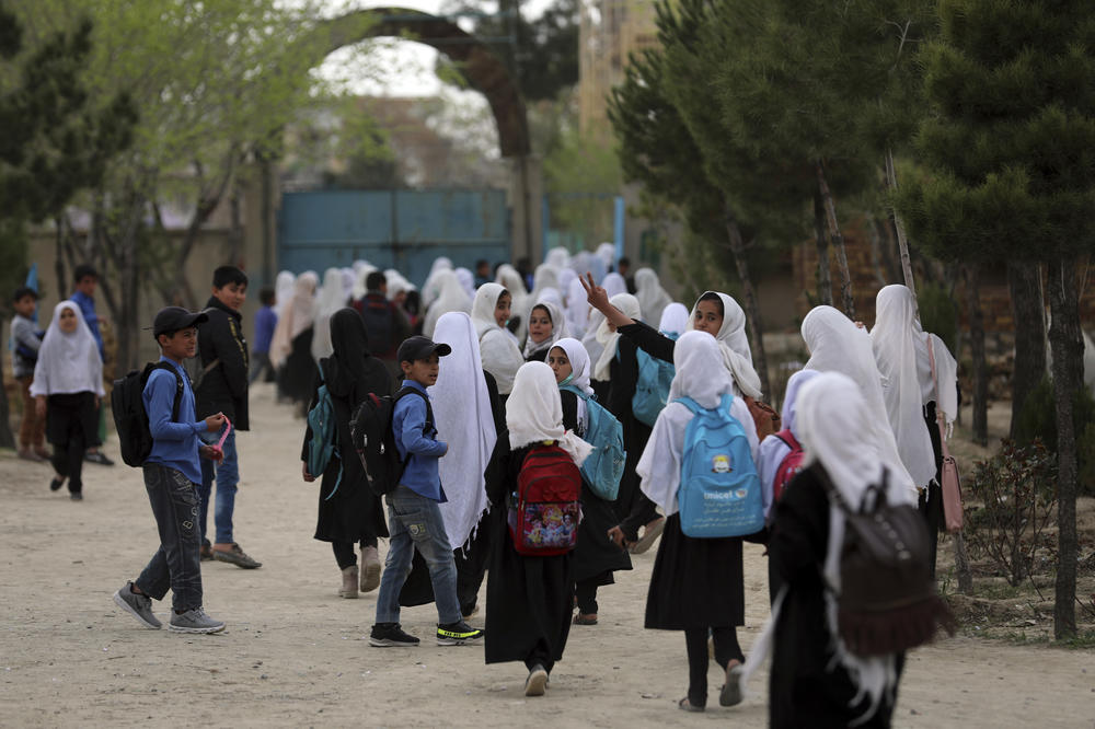 Afghan students leave classes in a primary school in Kabul, on March 27, 2021.