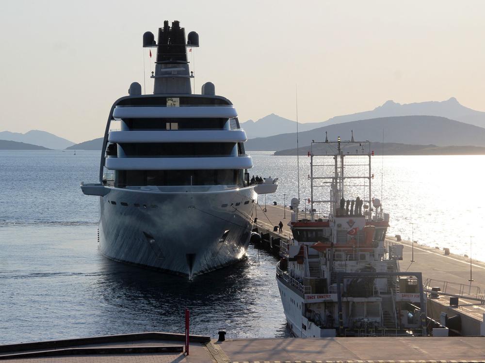 A yacht reportedly belonging to Russian oligarch Roman Abramovich is docked at an Aegean coastal resort in Bodrum, Turkey, on Monday. A group of young Ukrainian sailors had protested its arrival from a small boat.