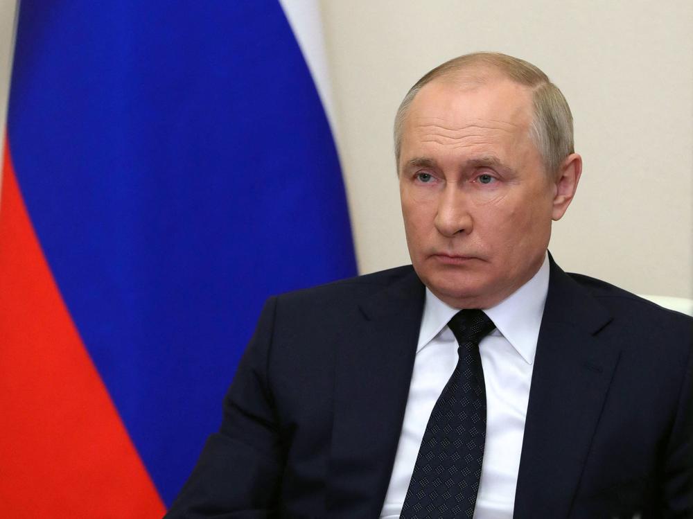 Russian President Vladimir Putin chairs a government meeting via a video link at the Novo-Ogaryovo state residence outside Moscow on Wednesday. Putin said Russia will only accept payments in rubles for gas deliveries to 