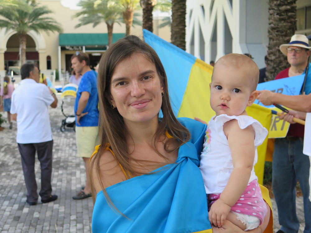 Victoria Hotova and her baby left their home in Kyiv last month. They attended a rally in support of Ukraine in Sunny Isles, Florida on Friday.