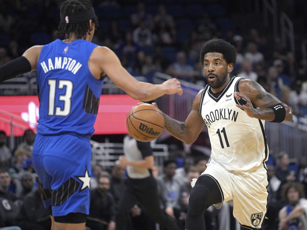Brooklyn Nets guard Kyrie Irving, number 11, is shown playing March 15, 2022, in Orlando, Fla.