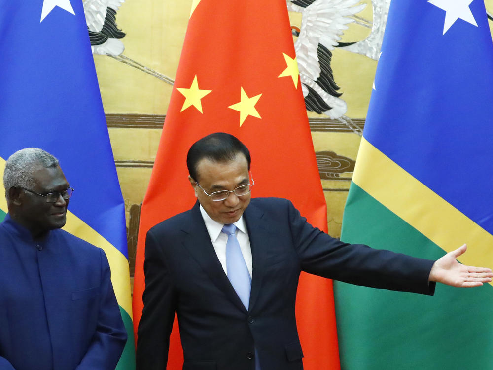 Solomon Islands Prime Minister Manasseh Sogavare, left, and Chinese Premier Li Keqiang attend a signing ceremony at the Great Hall of the People in Beijing, on Oct. 9, 2019.