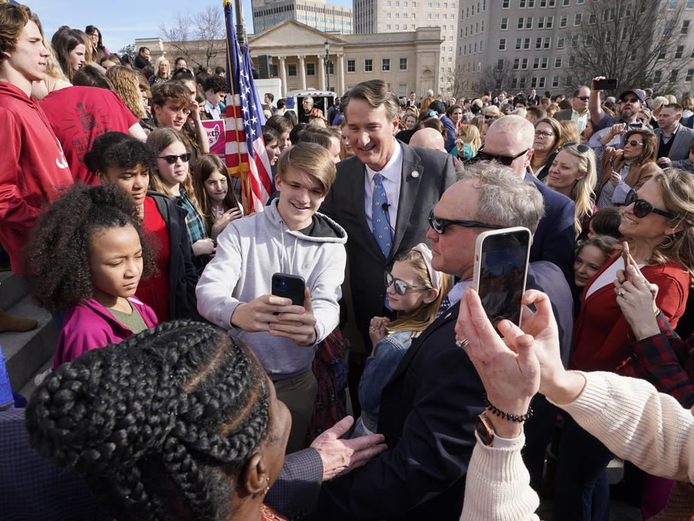 Last month, Virginia Gov. Glenn Youngkin posed with school children and parents after signing a bill that bans mask mandates in public schools in Virginia.