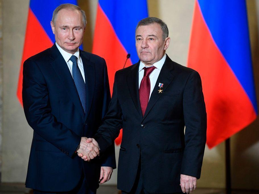 Russian President Vladimir Putin decorates oligarch Arkady Rotenberg with the Hero of Labour medal during an awards ceremony for those who led the construction of the Crimean Bridge over the Kerch Strait, which that links mainland Russia to Moscow-annexed Crimea.