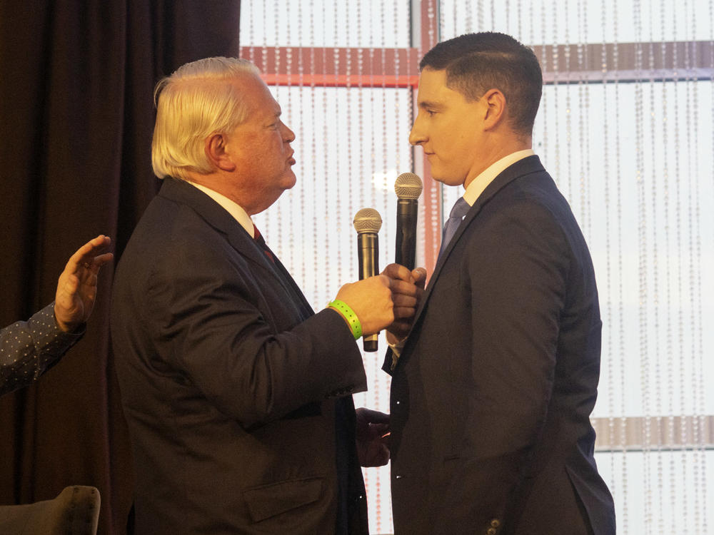 Ohio Republican U.S. Senate candidates Mike Gibbons (left) and Josh Mandel exchange heated words at a forum put on by FreedomWorks on March 18 outside of Columbus. The two have polled atop the contested GOP primary.