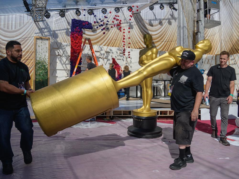 Workers prepare the red carpet area on Friday ahead of the Oscars at the Dolby Theatre.