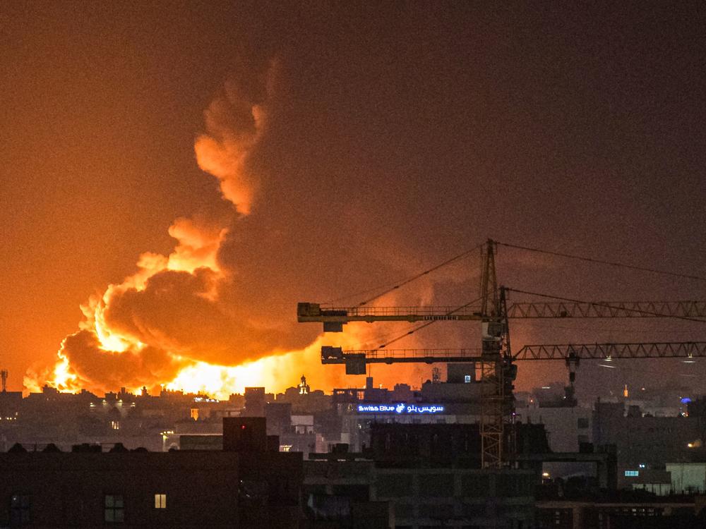 Smoke and flames rise from a Saudi Aramco oil facility in Jeddah following a reported attack by Yemeni rebels. A huge cloud of smoke was seen near the Formula One venue in the city following the attack.