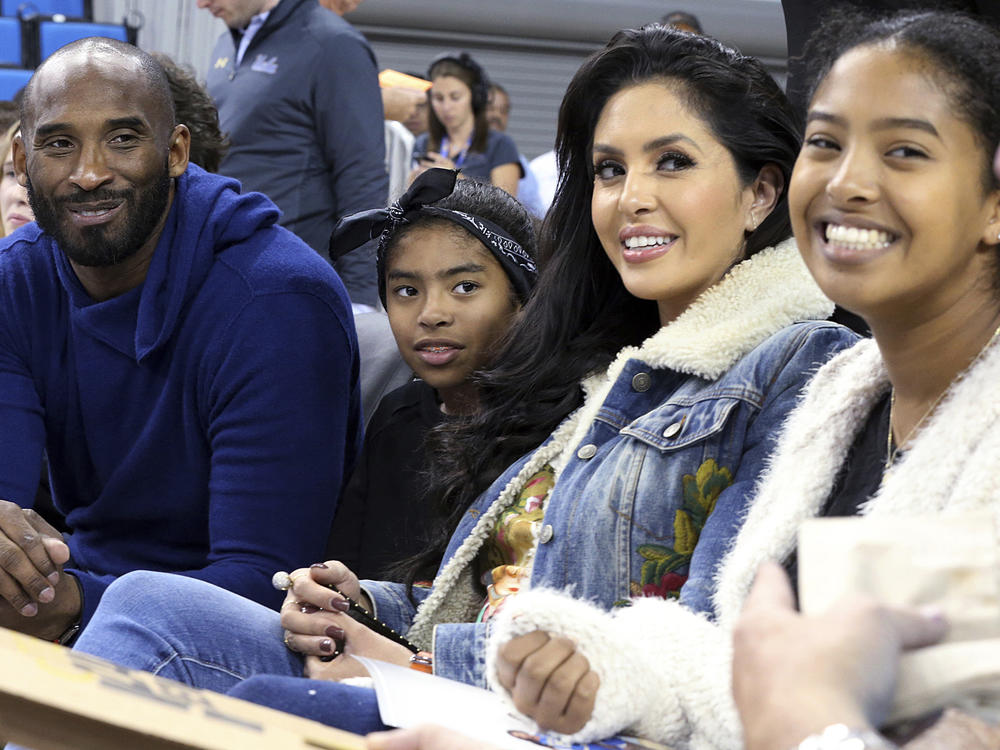 In this Nov. 21, 2017, file photo, from left, Los Angeles Lakers legend Kobe Bryant, his daughter Gianna Maria-Onore Bryant, wife Vanessa and daughter Natalia Diamante Bryant are seen before an NCAA college women's basketball game between Connecticut and UCLA, in Los Angeles.