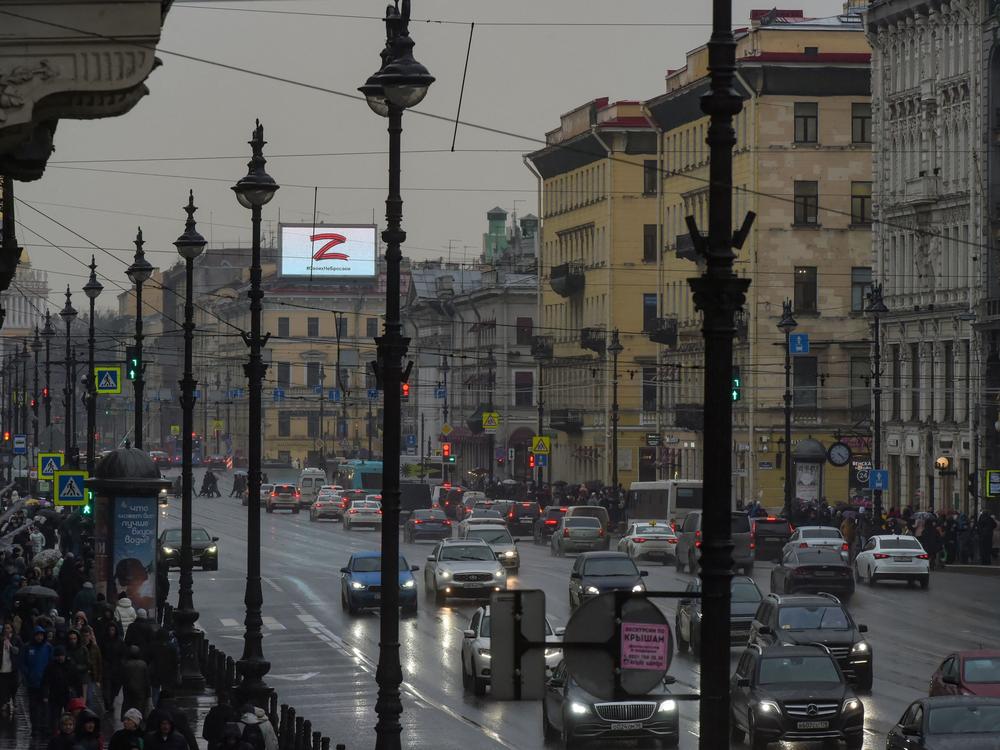 A screen on the roof of a building in central St. Petersburg, Russia, displays the symbol 