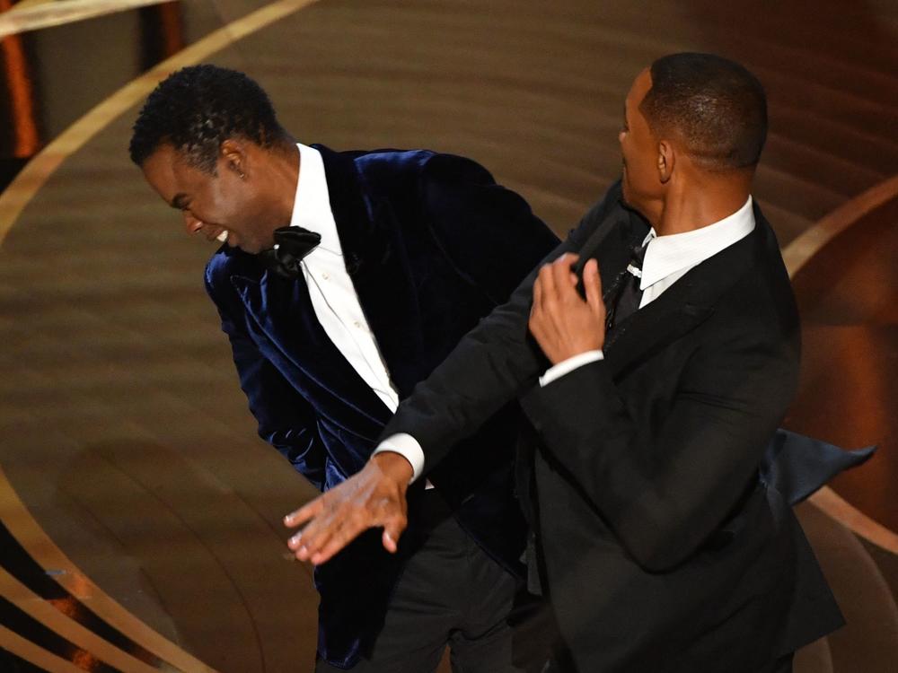 Will Smith slaps actor and comedian Chris Rock onstage during the Oscars.