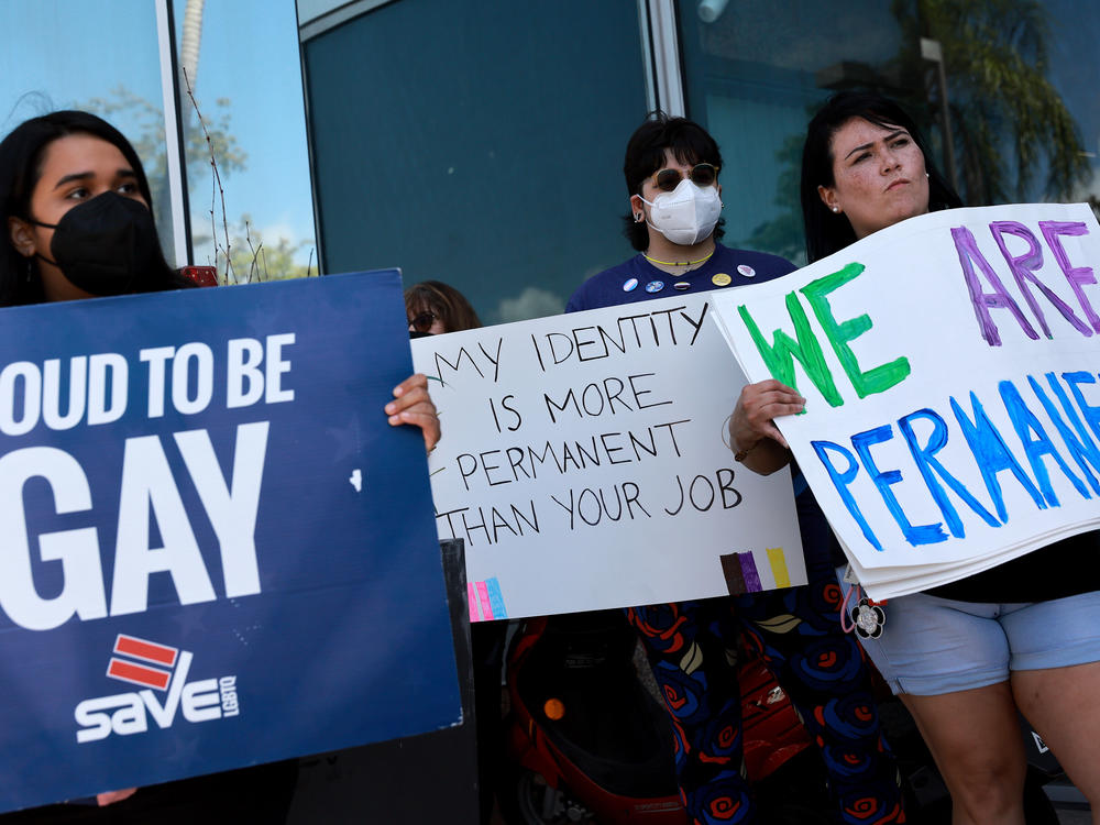 Protestors stand in front of Florida State Senator Ileana Garcia's office after the passage of the Parental Rights in Education bill on March 9.