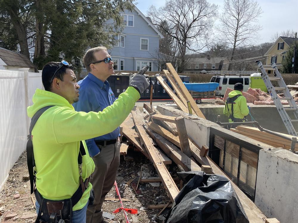 Builder Emerson Claus and his foreman Rene Landeverde at the site of an apartment they are building in a suburb of Boston.