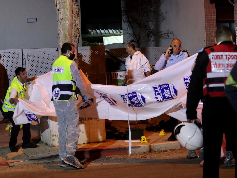 Israeli security forces gather at the site of an attack that left two Israeli police dead in the northern city of Hadera on Sunday.