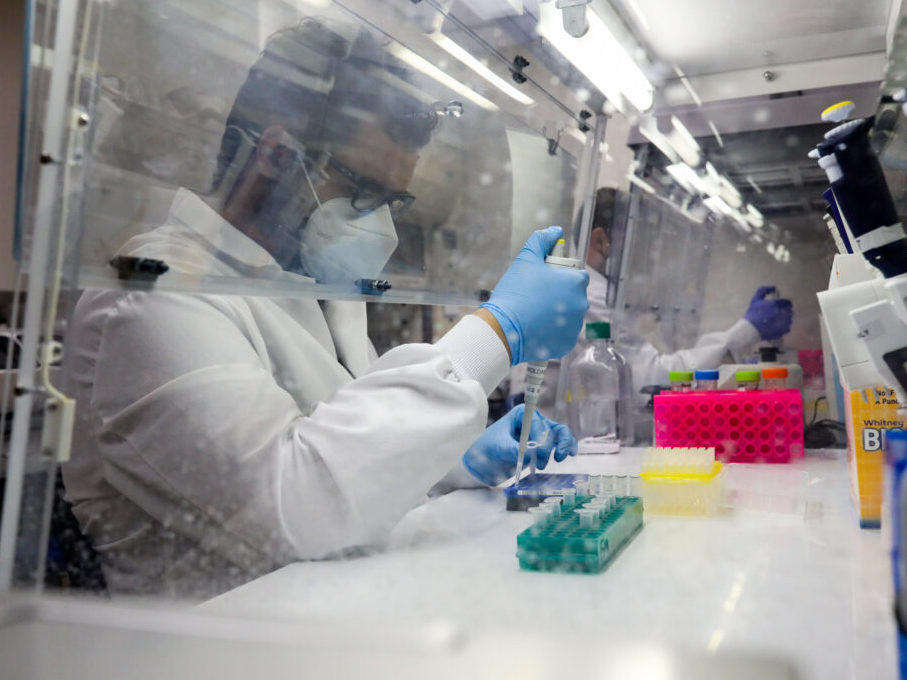 Molecular scientist Daniel Mallal runs a test at the Colorado Department of Public Health and Environment lab in Lowry.