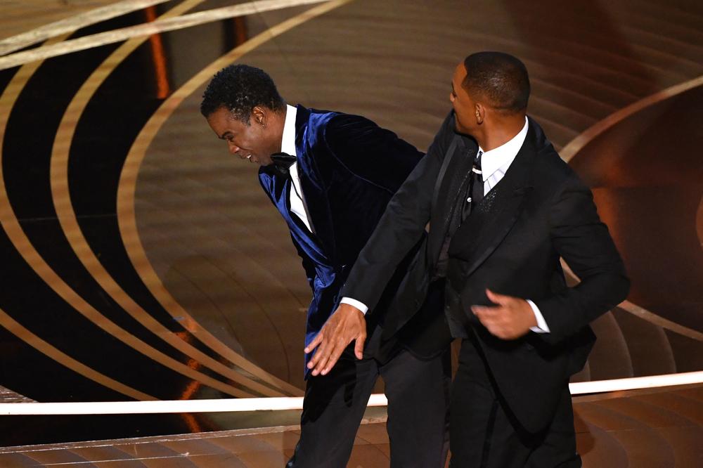Will Smith slaps Chris Rock onstage during the 94th Oscars on Sunday.
