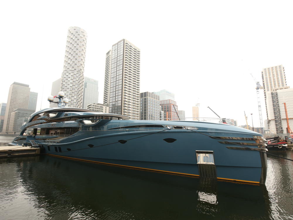 The newly-detained superyacht Phi is pictured while docked in Canary Wharf in east London on Tuesday.
