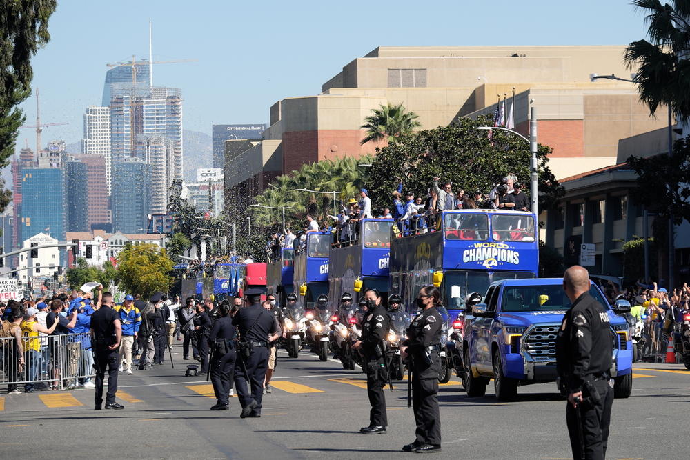 Police stand by as people celebrate at the Los Angeles Rams' Super Bowl victory parade and rally on Feb. 16.