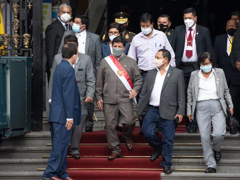 Pedro Castillo, Peru's president, center, leaves for an impeachment hearing at the Congress of the Republic in Lima, Peru, on Monday.