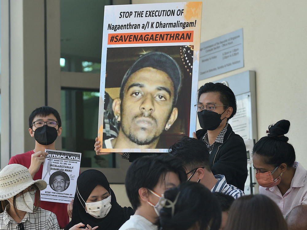 Activists hold posters against the execution of Nagaenthran K. Dharmalingam, sentenced to death for trafficking heroin into Singapore, outside the Singapore High Commision in Kuala Lumpur on March 9, 2022.