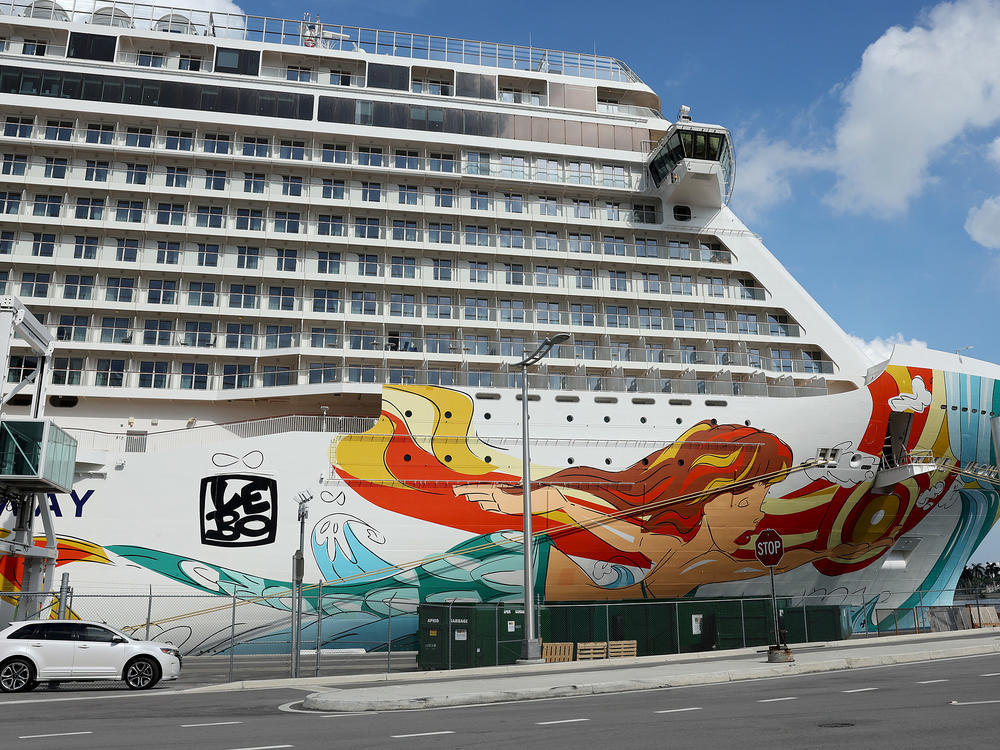 The Norwegian Gateway cruise ship is moored at PortMiami on Jan. 7 in Miami. The Centers for Disease Control and Prevention dropped its advisory warning Wednesday for cruise travel after more than two years of warning Americans.