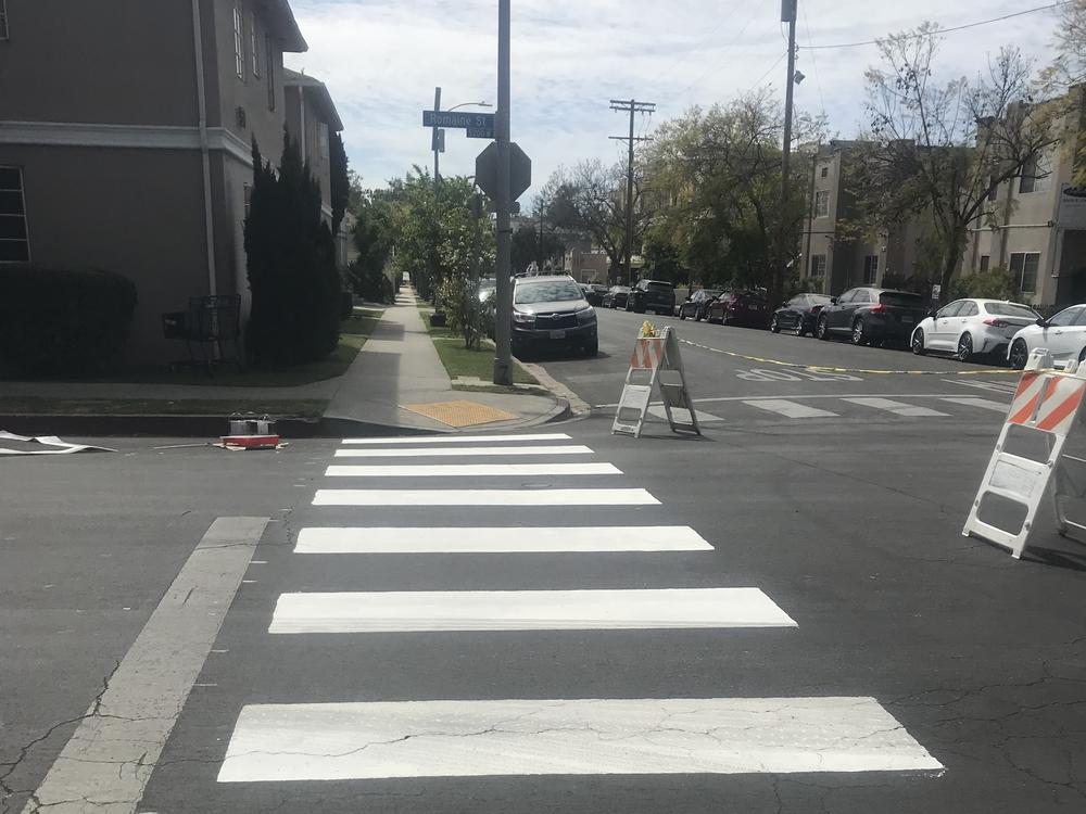 The Crosswalk Collective painted crosswalks at a four-way stop at the corner of Romaine Street and Serrano Avenue in Hollywood earlier this month.