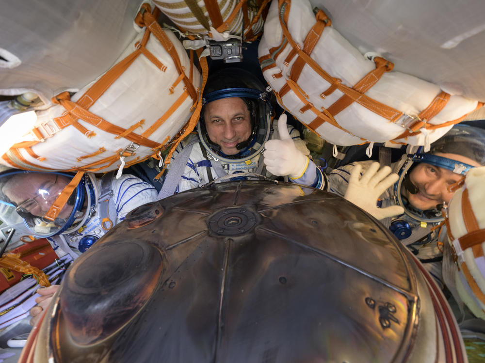 Expedition 66 crew members (left to right) Mark Vande Hei of NASA and cosmonauts Anton Shkaplerov and Pyotr Dubrov of Roscosmos are seen inside their Soyuz MS-19 spacecraft after it landed in a remote area near the town of Zhezkazgan on Wednesday in Zhezkazgan, Kazakhstan.