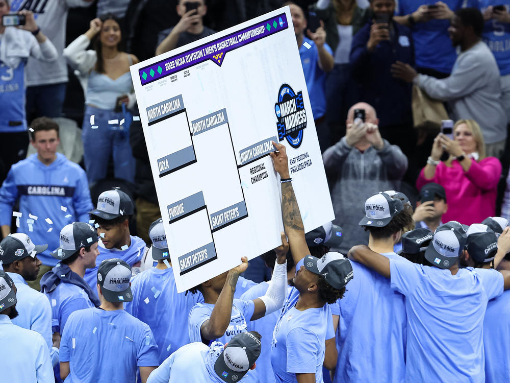 Leaky Black #1 of the North Carolina Tar Heels places the team name on the East Regional Champion bracket slot after the Elite Eight round of the 2022 NCAA Men's Basketball Tournament game against the Saint Peter's Peacocks on March 27 in Philadelphia.