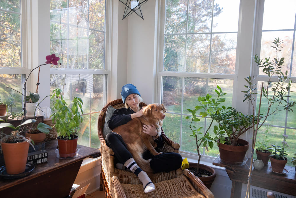 Hanna Wilt with her dog Haku in November in Manasquan, N.J. Wilt was 22 when she felt the first symptoms of an aggressive form of cancer called mesothelioma.