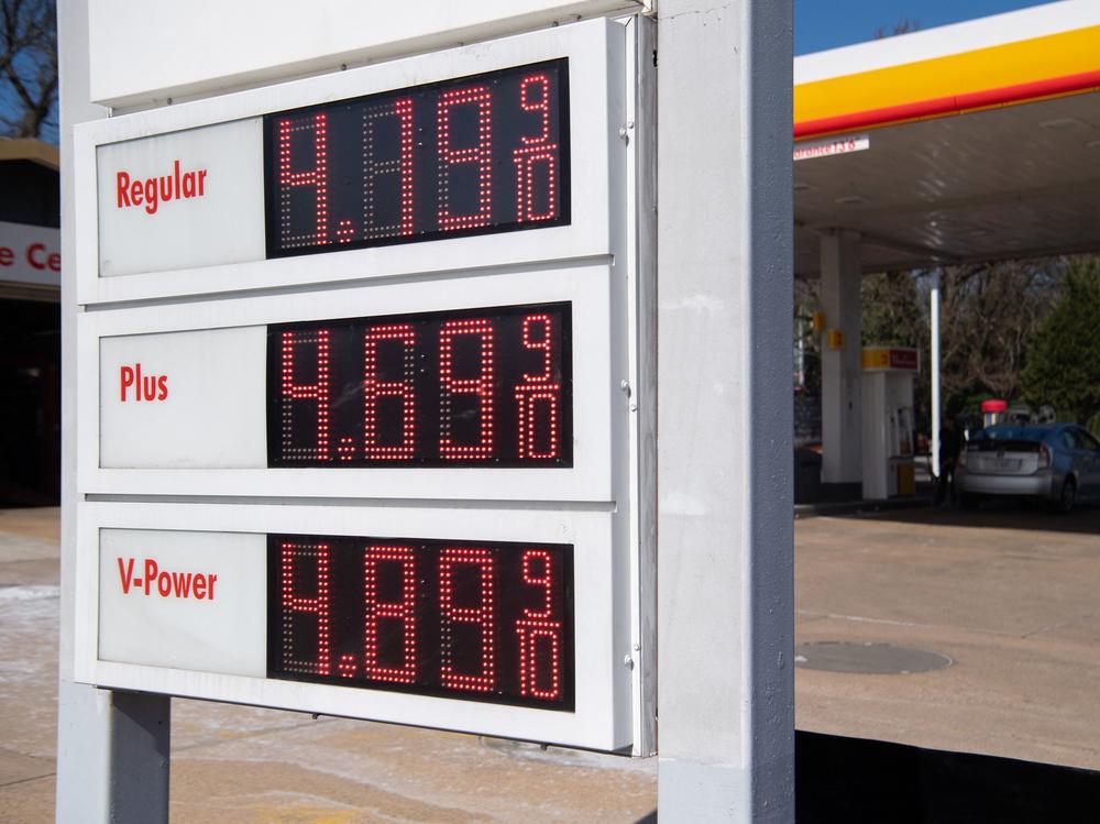 A sign displays fuel prices at a gas station in Arlington, Va., on March 16. President Biden announced on Thursday the country's largest-ever release from its Strategic Petroleum Reserve.